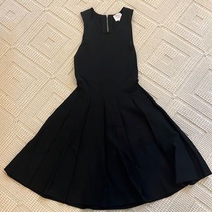 Black Parker dress with key hold detail on back.